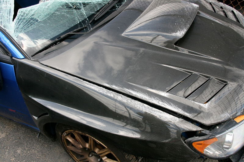 Illustration for article titled Subaru STI Hits Two Trees At Speed, Flips Twice, Everyone Survives!